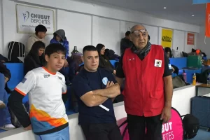 Nelson junto a su entrenador Ismael Franco (Foto: Chubut Deportes / Facebook).